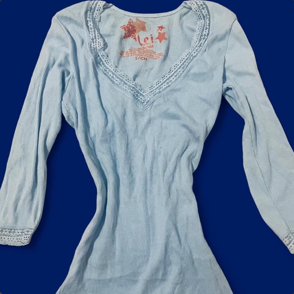 Blue babydoll v-neck top with lace trim